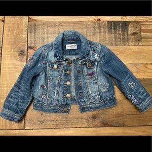 Baby Gap denim jacket with embroidered details.